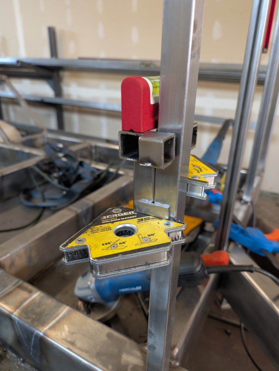 Made a little tool out of scrap that makes putting crossmembers up easier in a line.